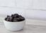 Prunes in White Speckled Bowl Beauty Shot