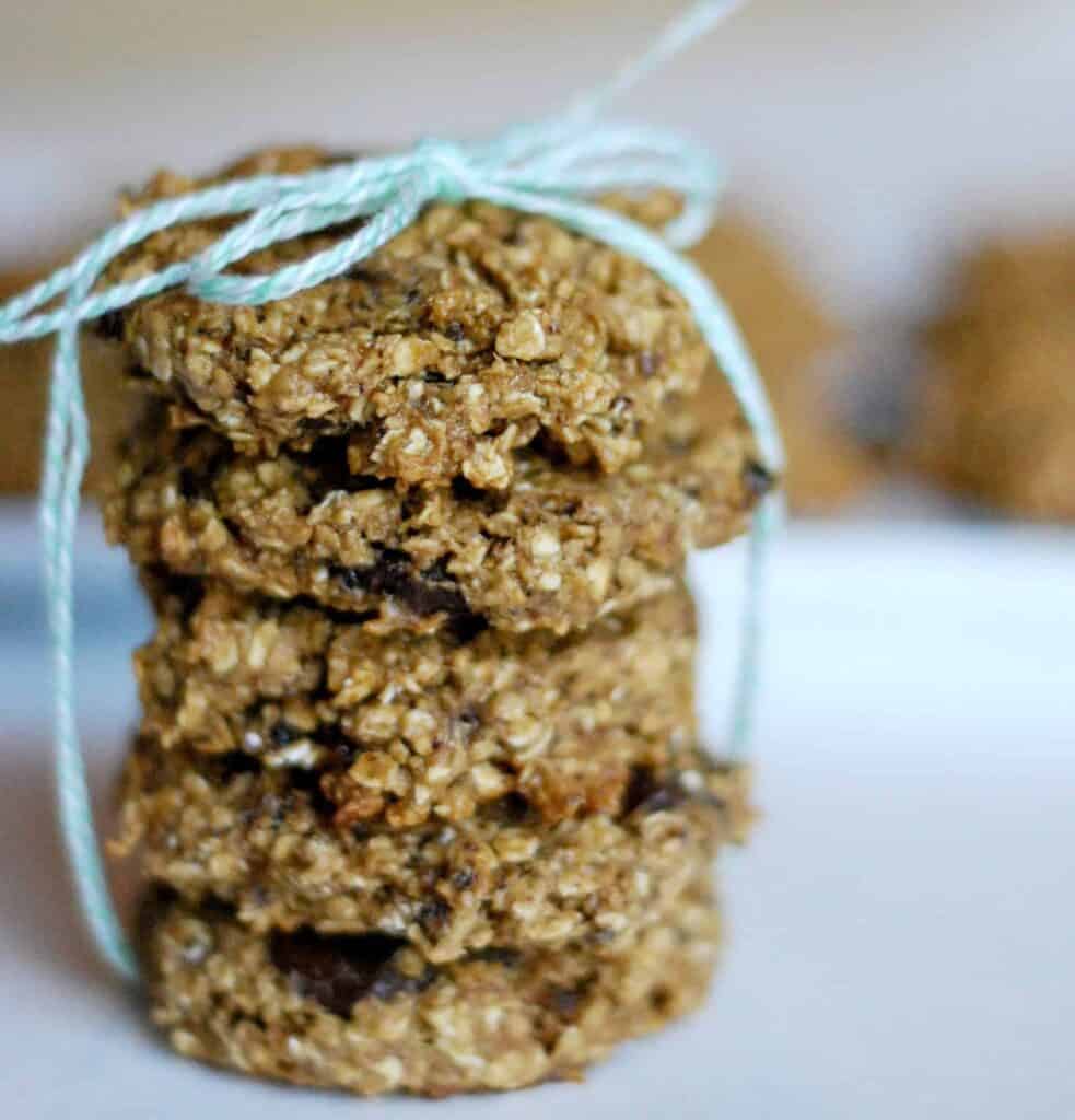 a stack of Chewy Oatmeal Chocolate Chip Cookies tied with a blue string