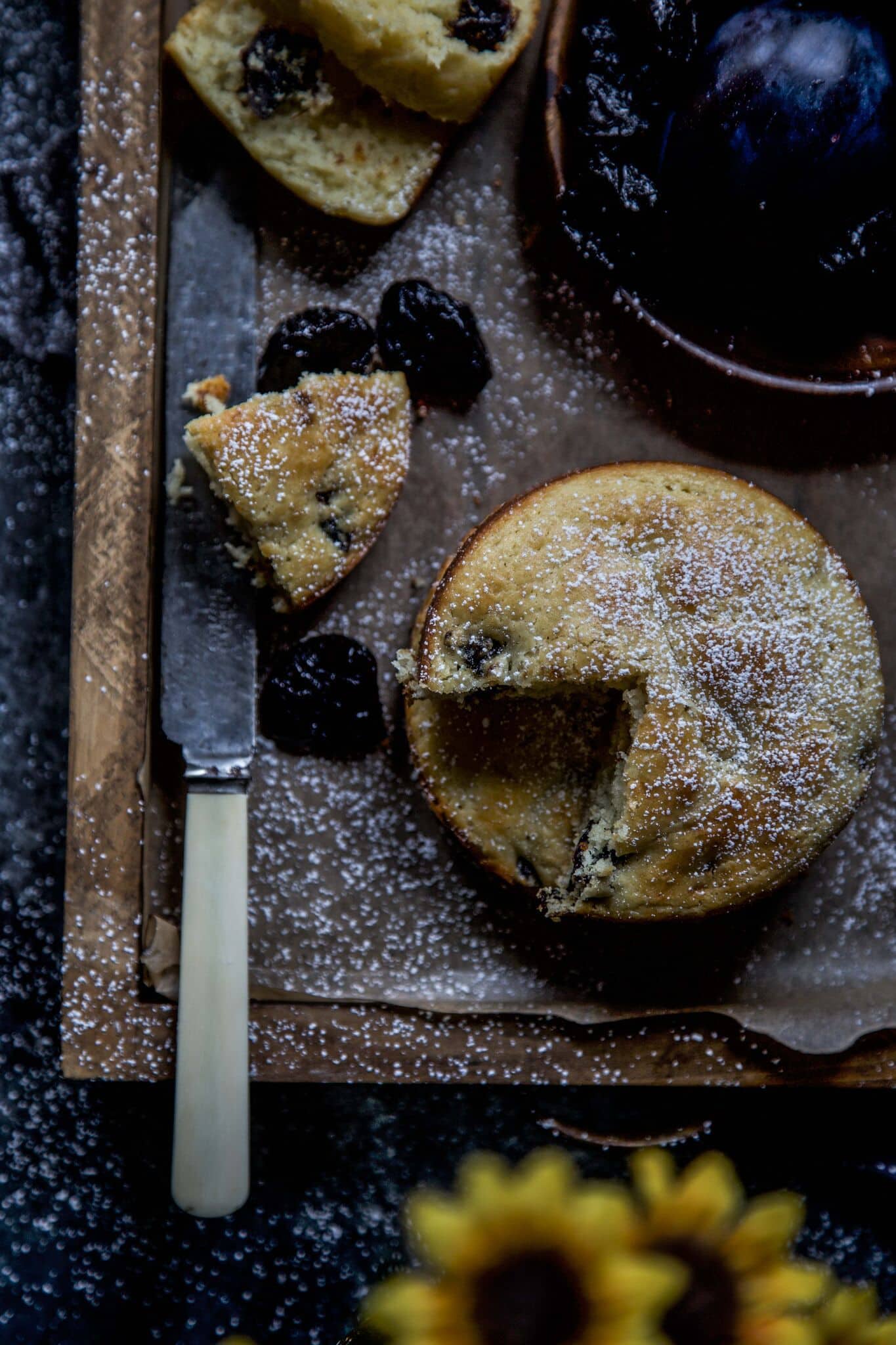 a wooden platter of Cardamom and Prune Ricotta Cakes