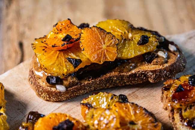 slice of toast with broiled citrus and prunes