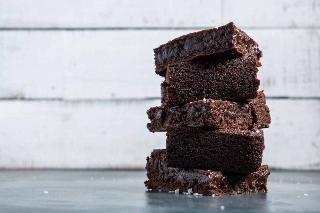a stack of vegan brownies on the counter
