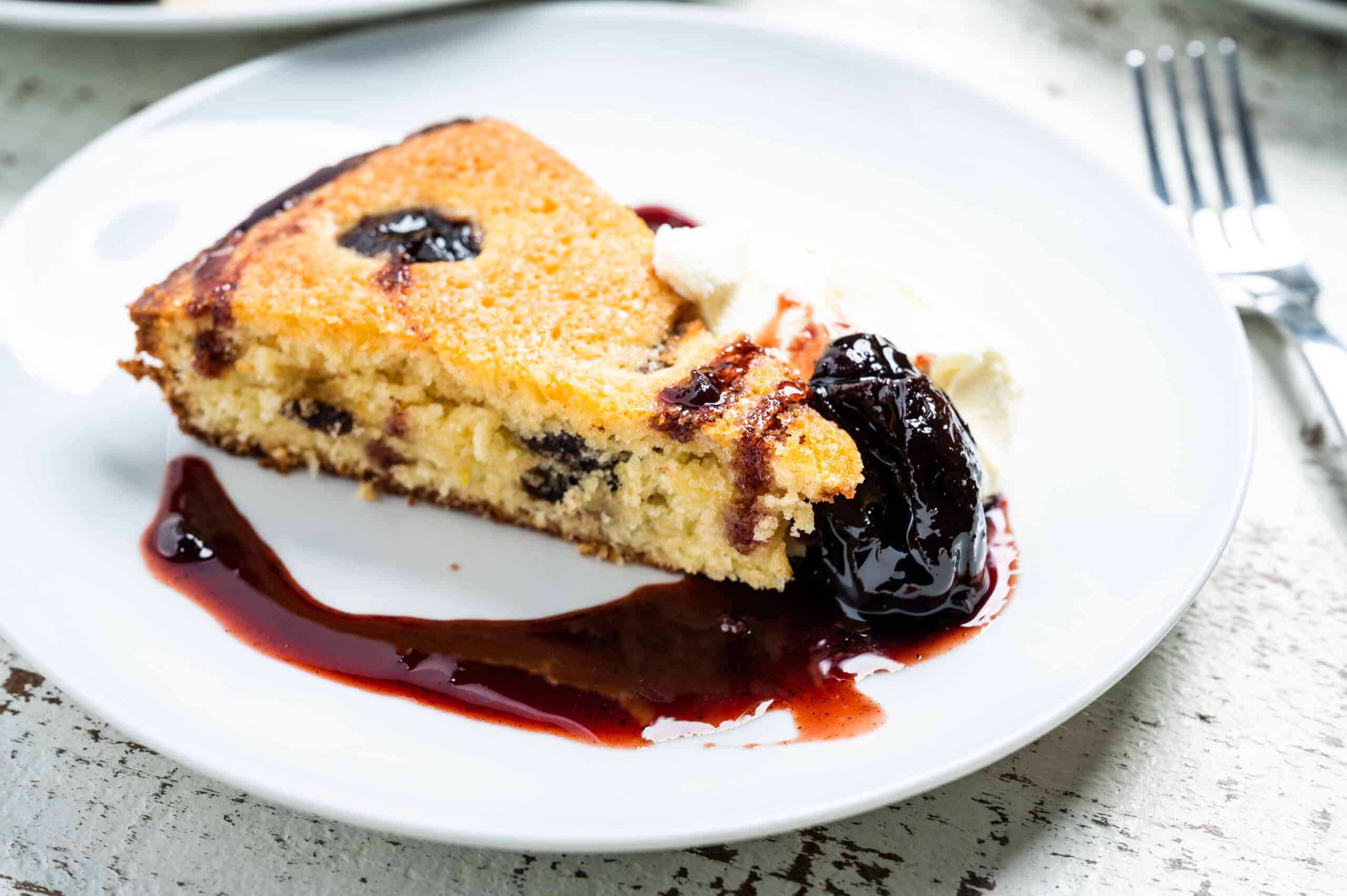 a slice of Mascarpone Cake with Red Wine Prunes from Claire Saffitz's Dessert Person