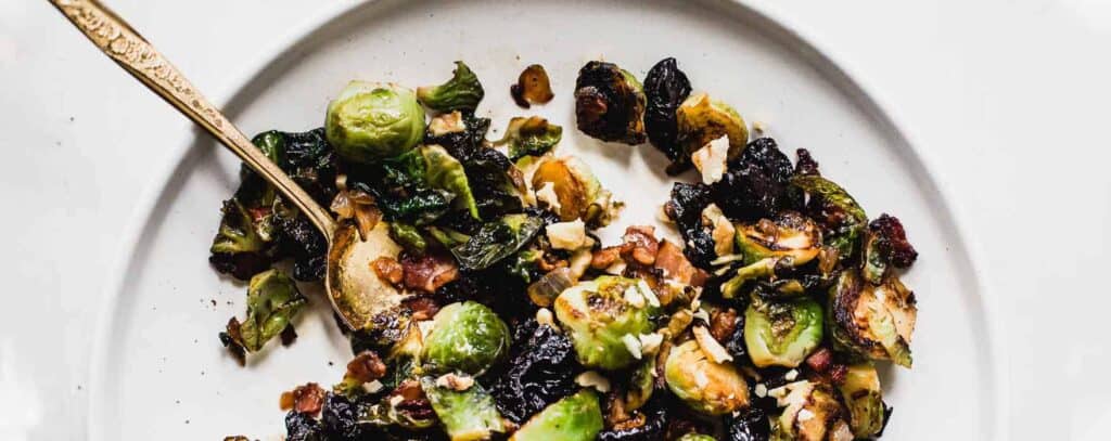 Sweet and Salty Brussels Sprouts||Roasted Cauliflower with Savory Peanut Sauce in bowl