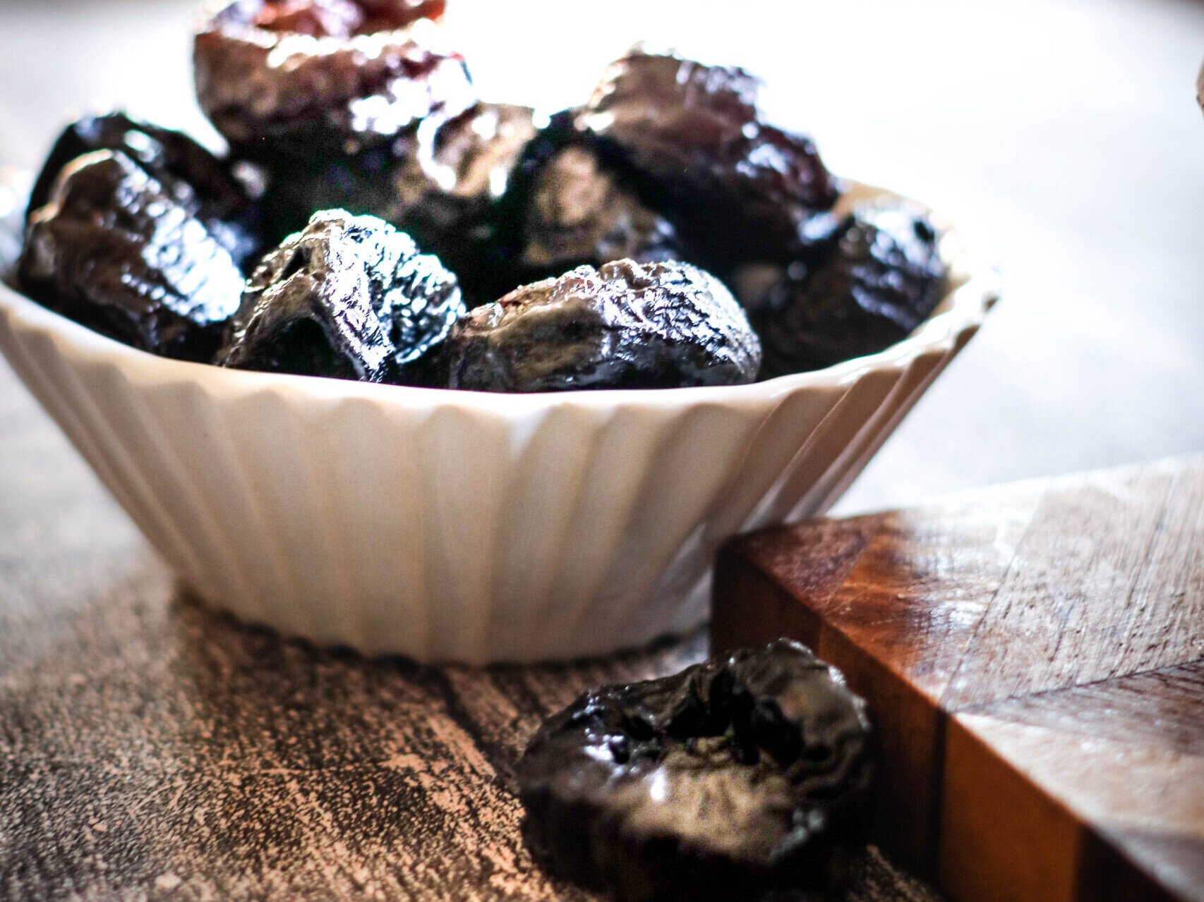 bowl of prunes. Prune puree is the base for this chocolate truffle recipe