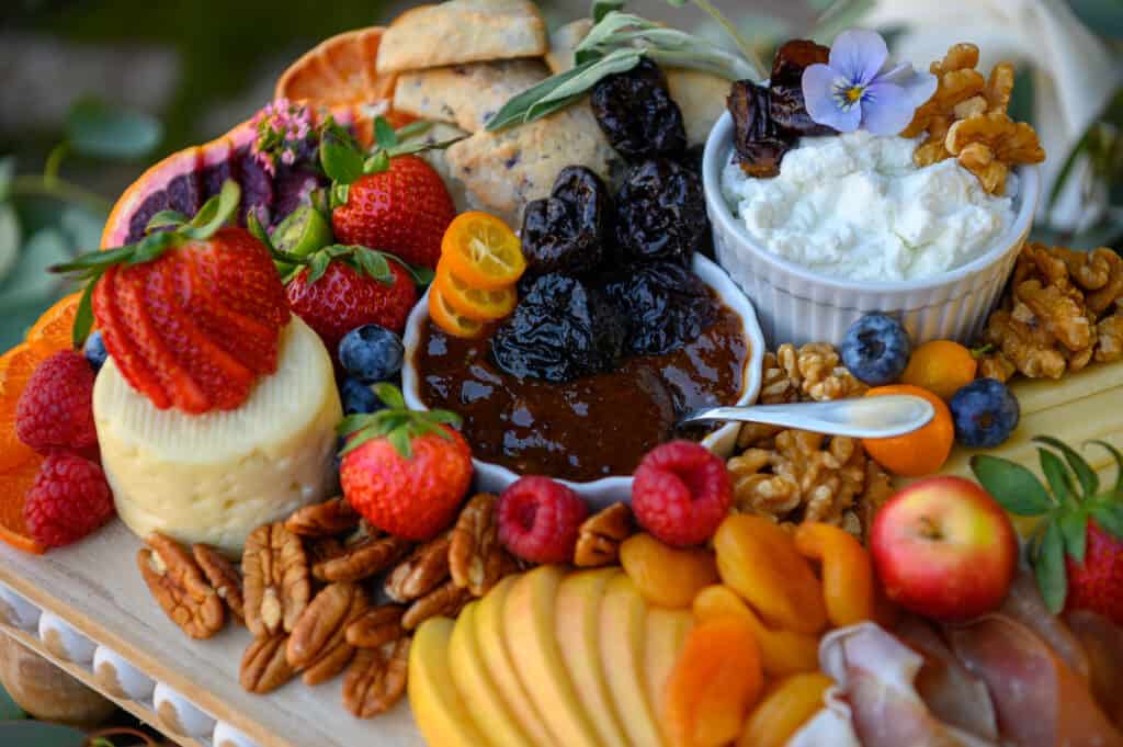 Prune Marmalade on a Cheese board with fruits and nuts