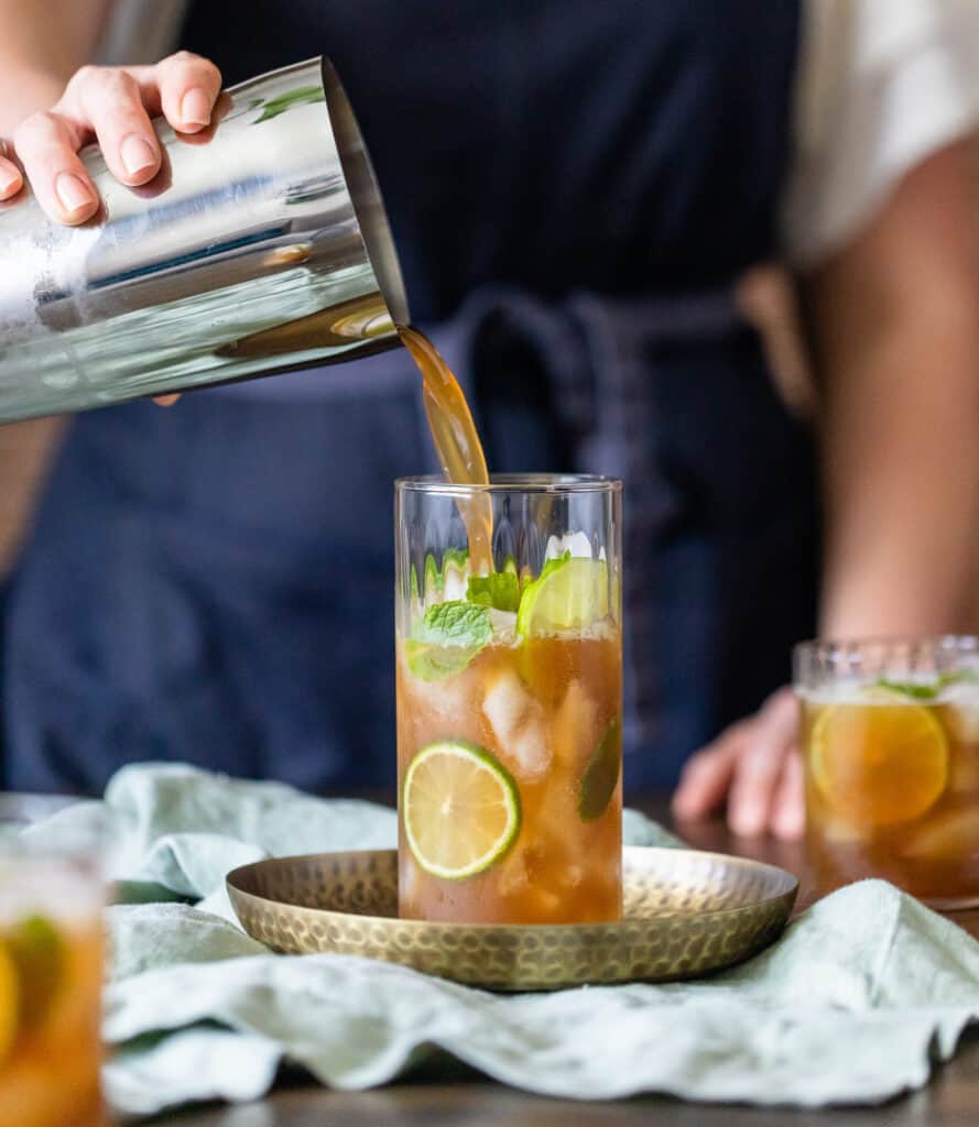 pouring Prune Juice Kombucha Mocktail into a glass