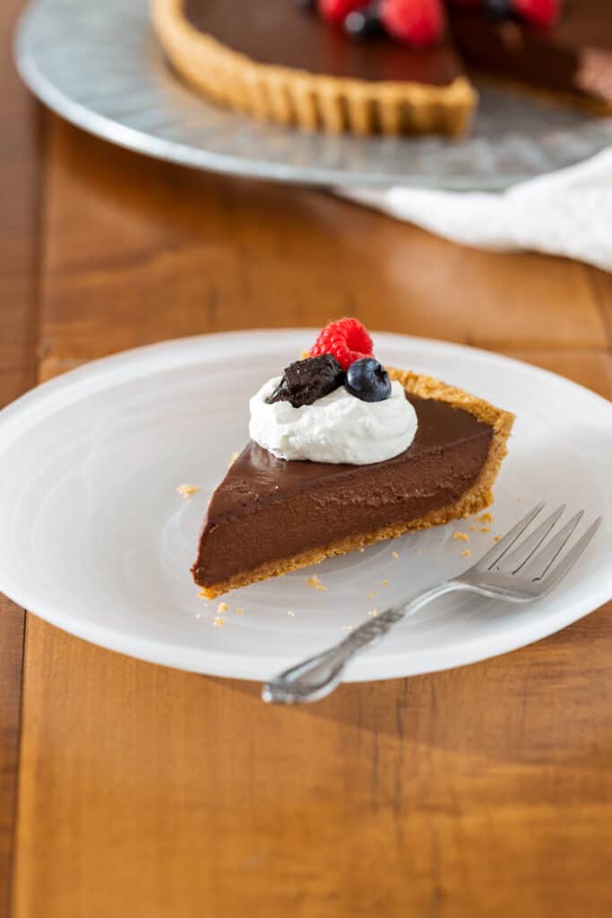 a plate with a slice of Silken Prune Chocolate Pie
