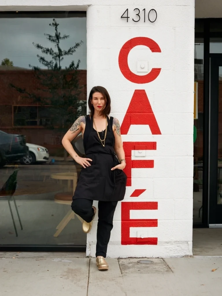 Chef Kat Turner standing in front of Highly Likely Cafe