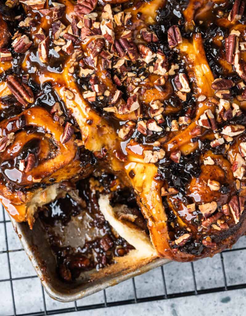 a pan of Pecan Sticky Buns with a slice removed