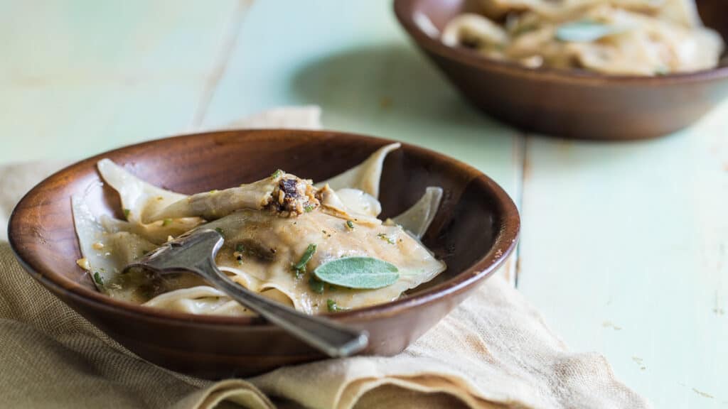 a bowl of Prune-filled Ravioli with Sage Butter