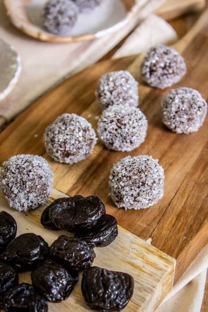 traditional sugar plums from G-Free Foodie on wooden cutting board with prunes