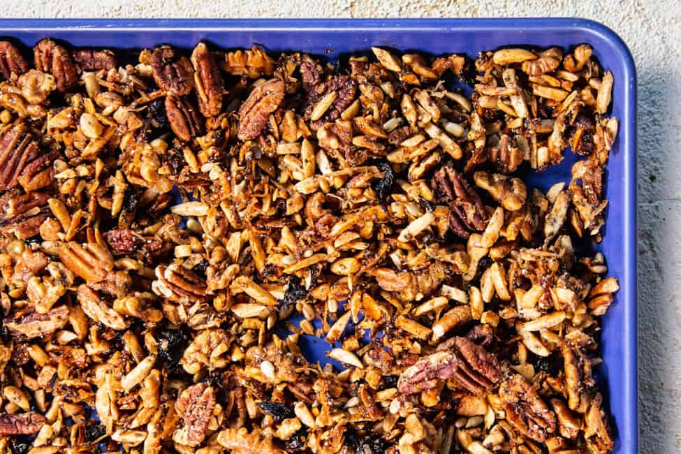 a blue baking tray full of grain-free granola