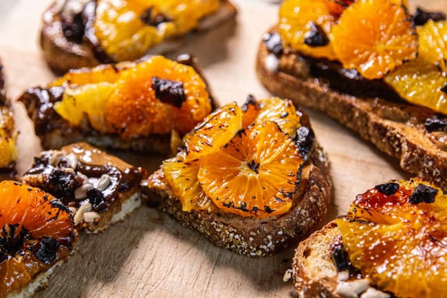 Toast with broiled citrus and prunes 