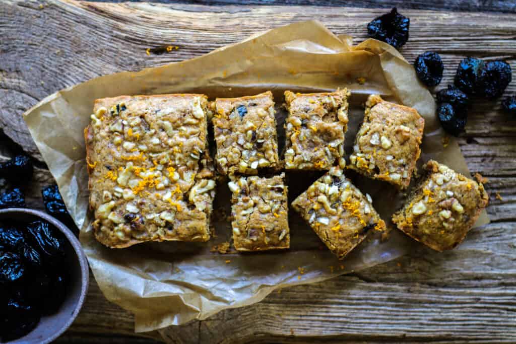 a sliced loaf of Spiced Snack Cake with citrus, walnuts, ginger and prunes