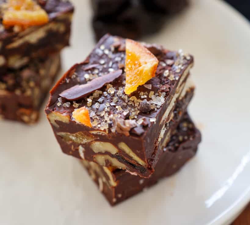 two fudge squares topped with salt and citrus