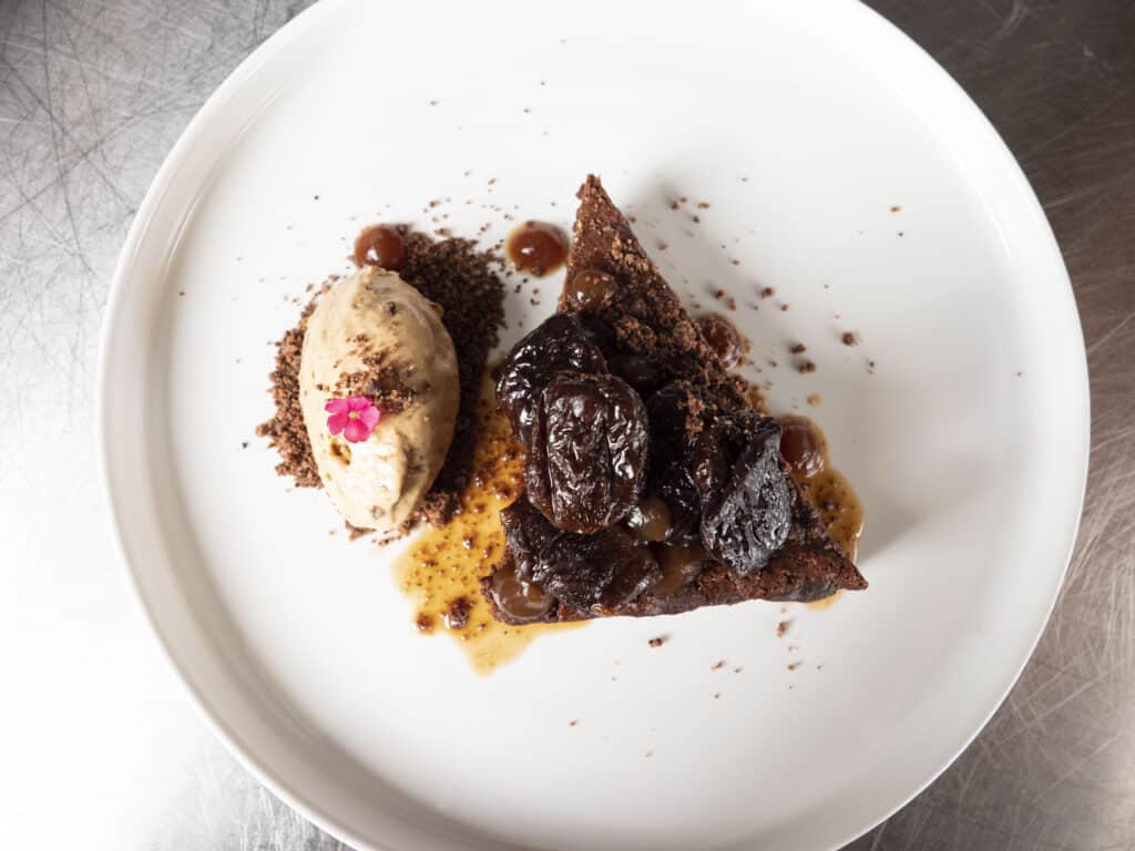 a plate filled with a chocolate torte created by Chef Ana Paola de Anda of Chef’s Roll