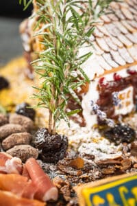 landscaping a gingerbread house with a tree made out of rosemary