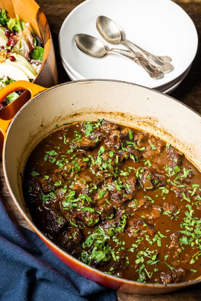 a serving dish with Stephanie Cmar's Beef Stew with Red Wine 