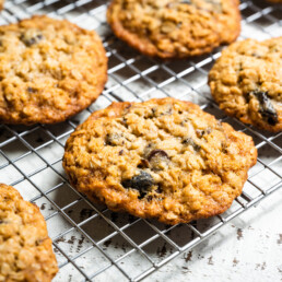 Cooling rack with Chewy Oatmeal Cookies with Chocolate and Chopped Prunes. This riff on our Chewy Oatmeal Chocolate Chip Cookies is inspired by one of our growers, who swaps the puree for chopped prunes, and uses dark honey from his own hives to give these an even richer flavor.