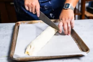 rolling a goat cheese strudel