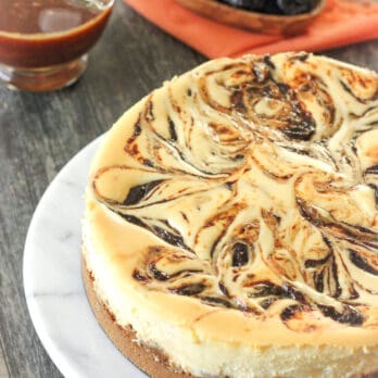 a plate of Rum-Soaked Prune Cheesecake with Salted Caramel Sauce