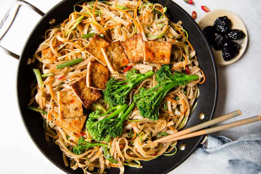 a pan with stir fry noodles from Healthy Nibbles and Bits with broccoli