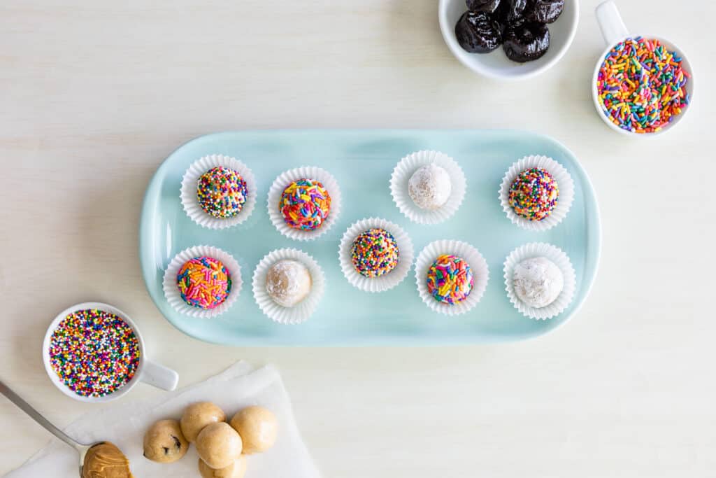 a tray filled with Confetti covered energy balls