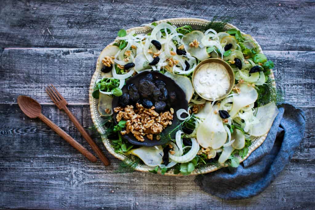 a bowl of prune, pear and fennel salad