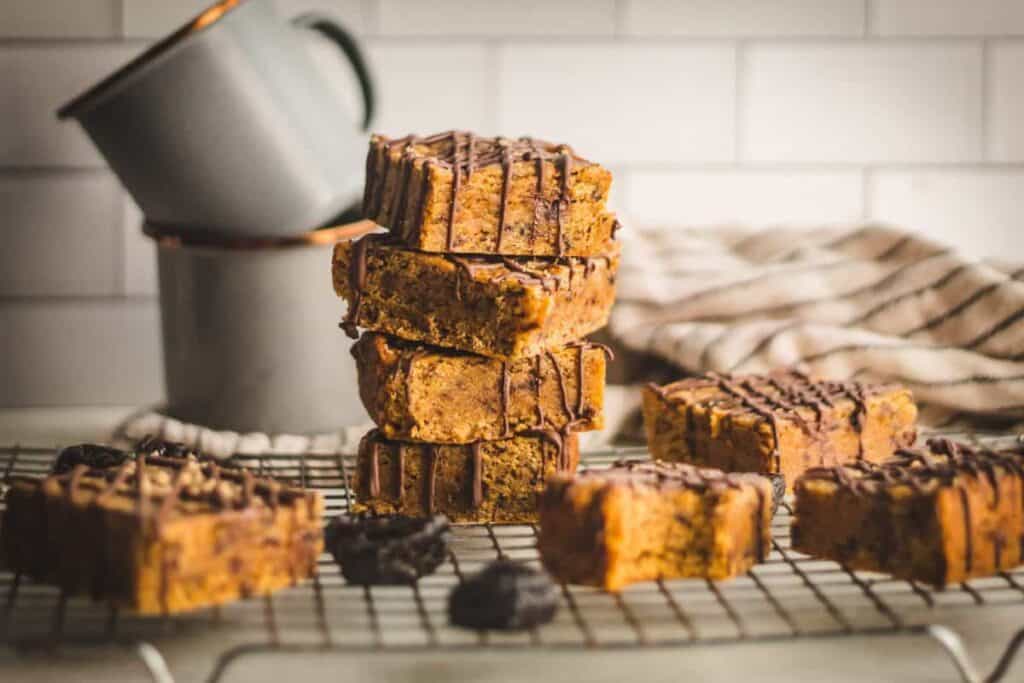 a cooling rack with slices of Miso Prune Blondies from Britney Breaks Bread