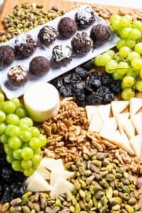 California prune snack tray with grapes, prunes, nuts and truffles
