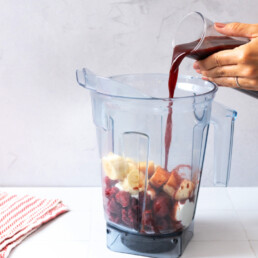 Adding Prune Juice & Smoothie ingredients to a blender for athletic performance