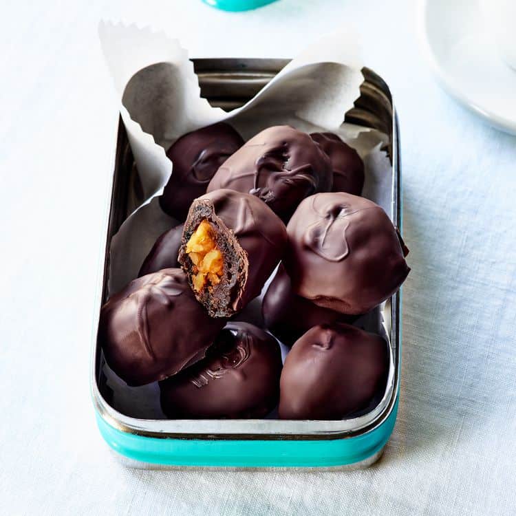 a tin of Greek-Style Chocolate Covered Walnut Stuffed Prunes from Food 52