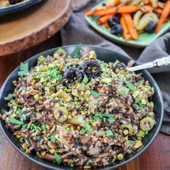 wild rice pilaf in a black serving bowl on a table