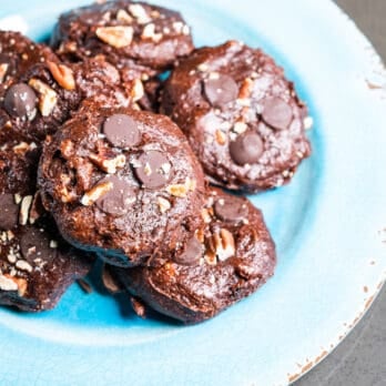 a plate of chocolate pecan cookies