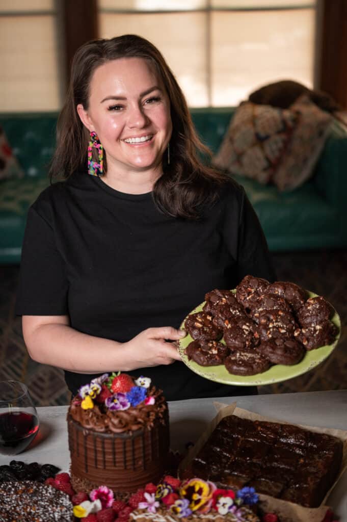 Rachel Dunston holding a plate of Chocolate Pecan Cookies