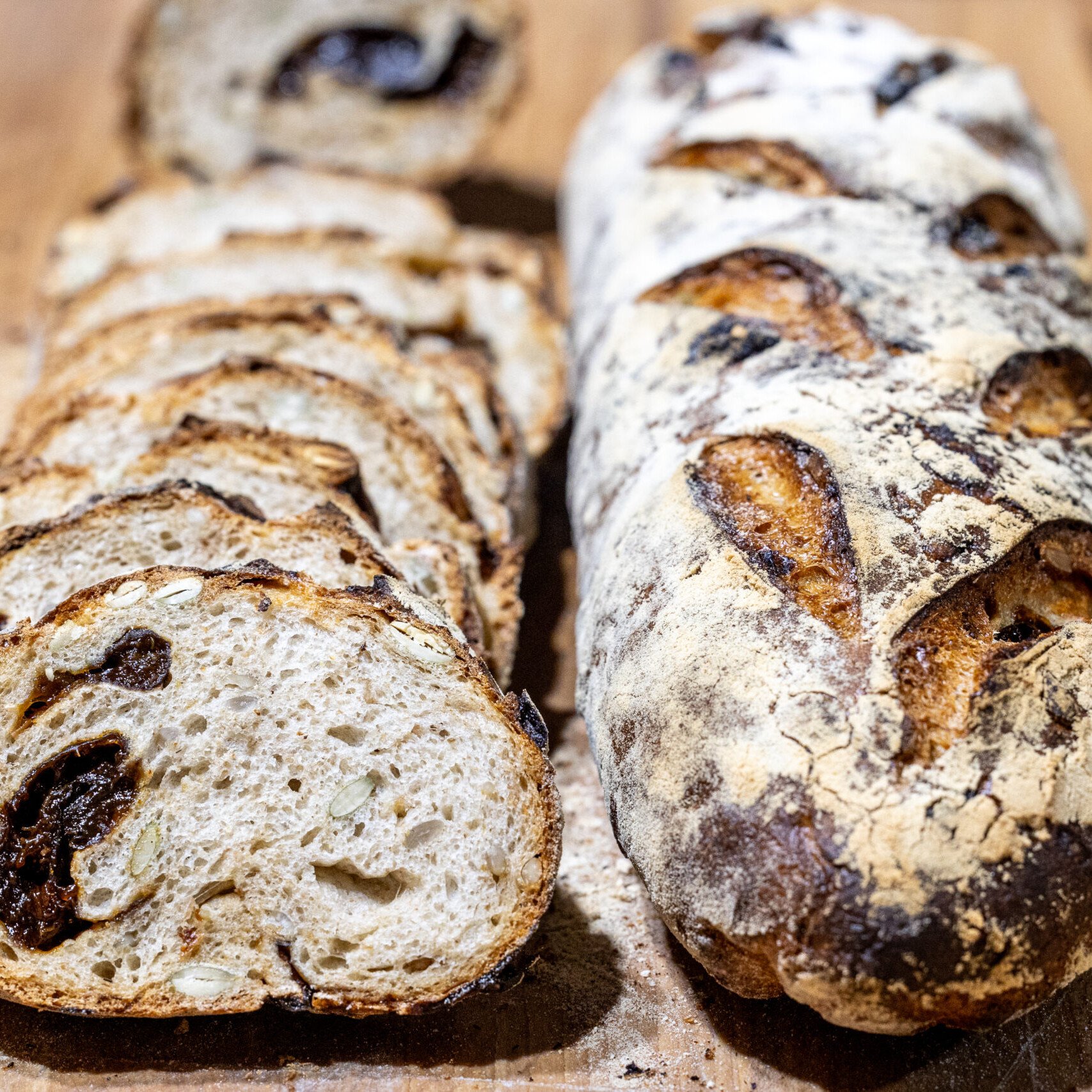 Prune seed bread loaves on a cutting board