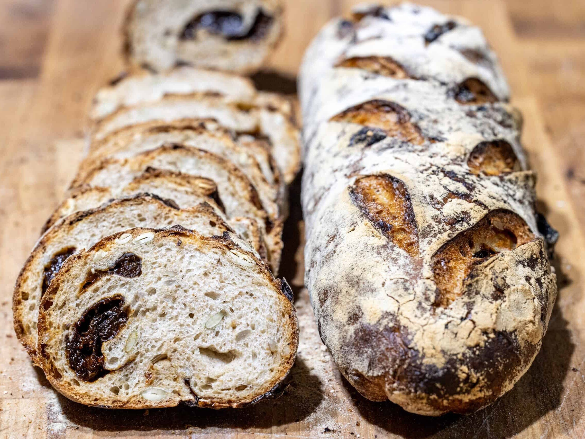 Prune seed bread loaves on a cutting board