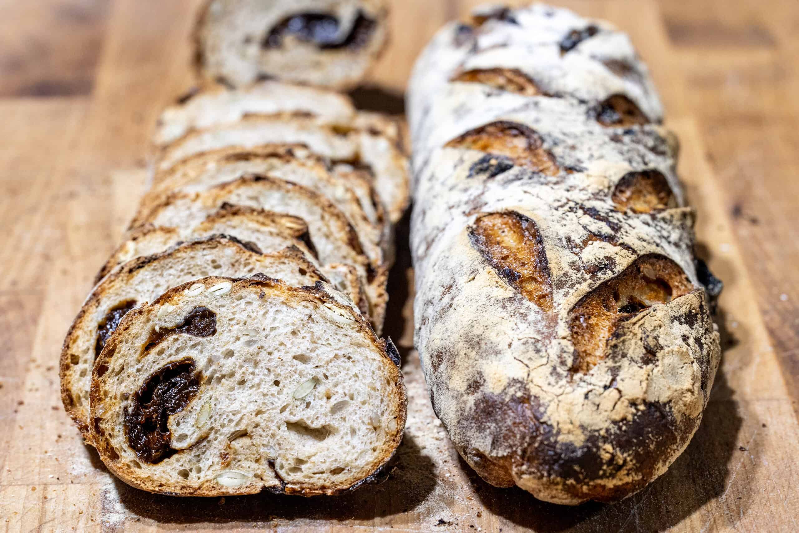 Prune seed bread loaves on a cutting board