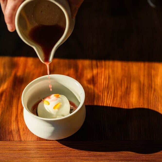 Candy Cap Mushroom ice cream with Prune oil drizzling over the top at Harbor House Restaurant