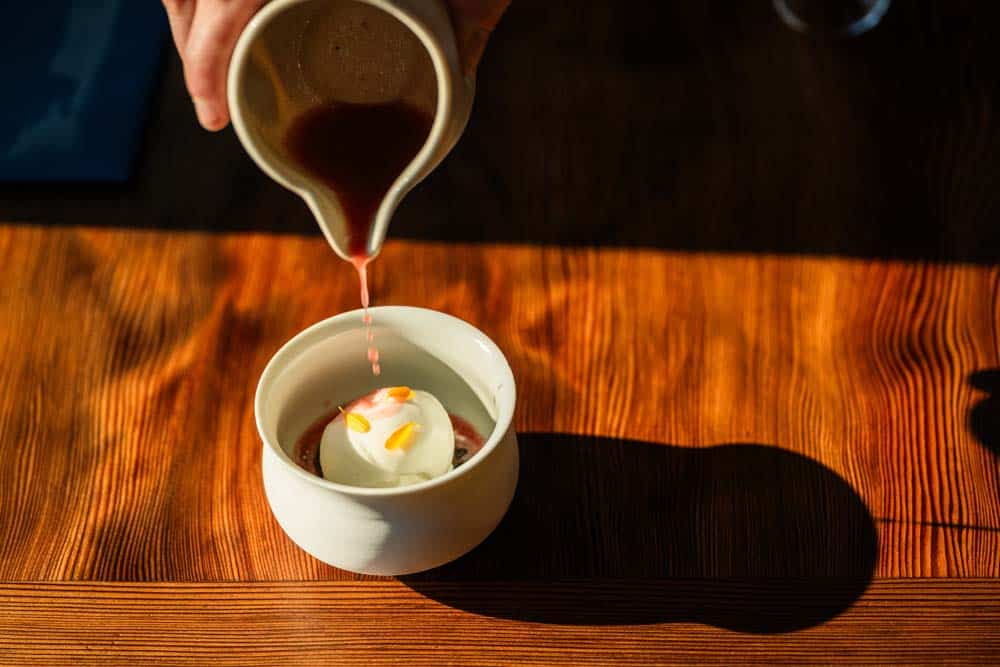 Candy Cap Mushroom ice cream with Prune oil drizzling over the top at Harbor House Restaurant