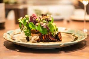 A The Boonville Hotel and Restaurant with Farm-Fresh Lettuces, Duck Liver Parfait, Dried and Pureed Prunes, Poached Prunes in Tea.