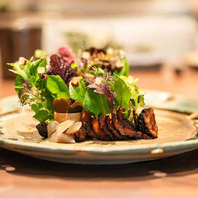 A The Boonville Hotel and Restaurant with Farm-Fresh Lettuces, Duck Liver Parfait, Dried and Pureed Prunes, Poached Prunes in Tea.