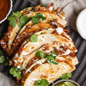 Multiple quesadillas on a serving platter.