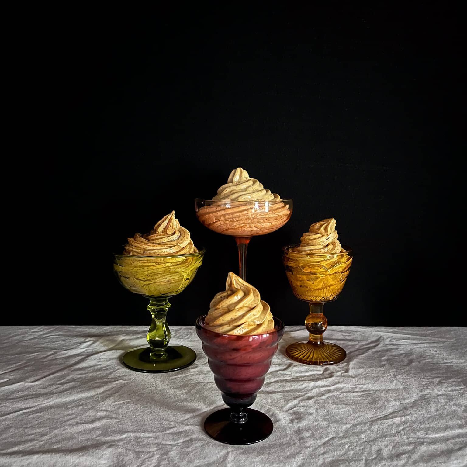 swirls of prune whip in colorful glass bowls