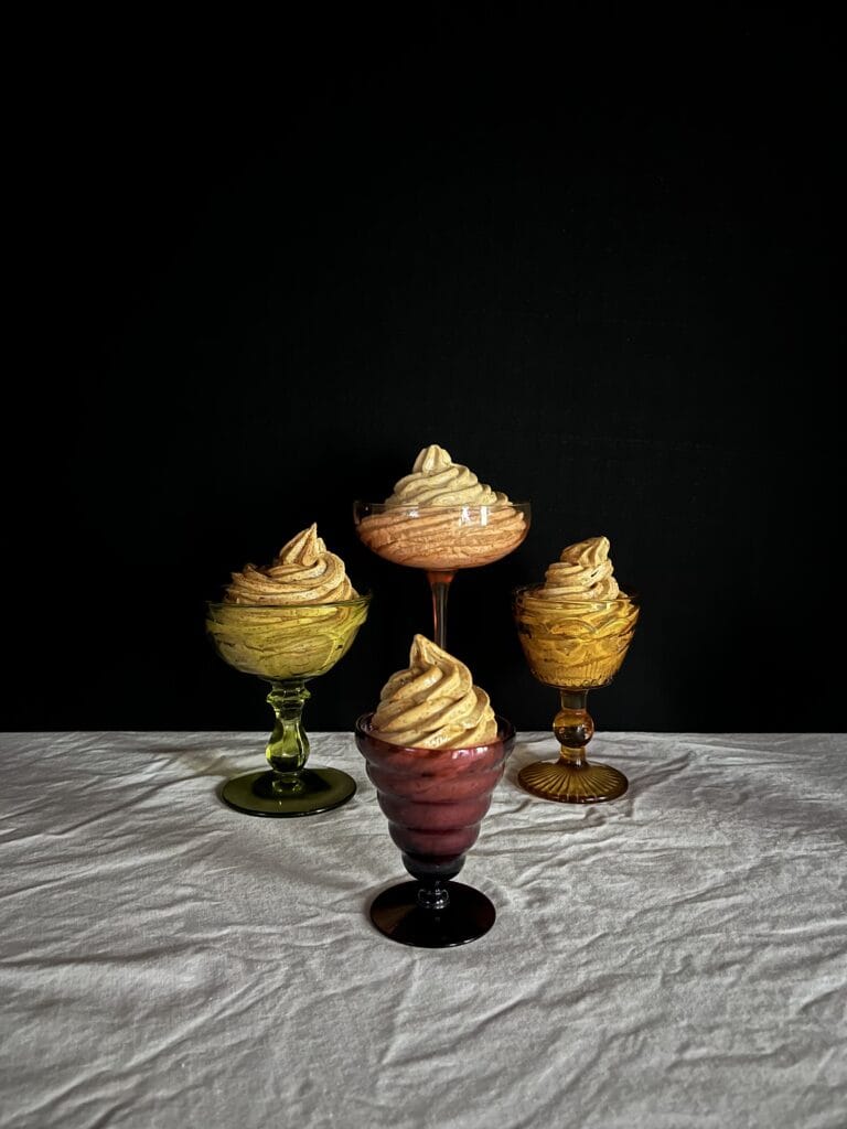 swirls of prune whip in colorful glass bowls