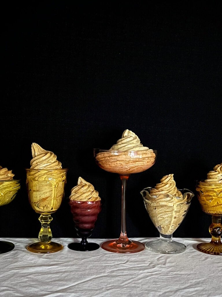 prune whip swirled in a in a variety of vintage glassware