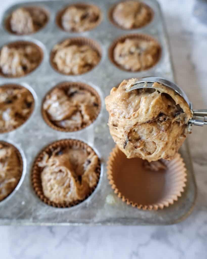 unbaked cinnamon muffins in a tin