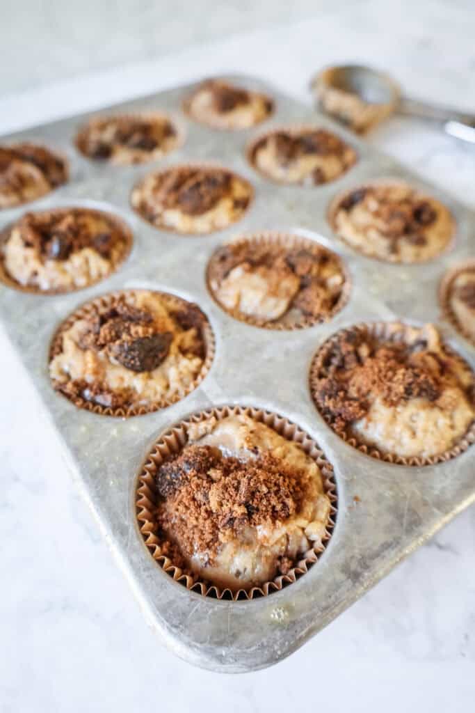 unbaked cinnamon muffins in a tin