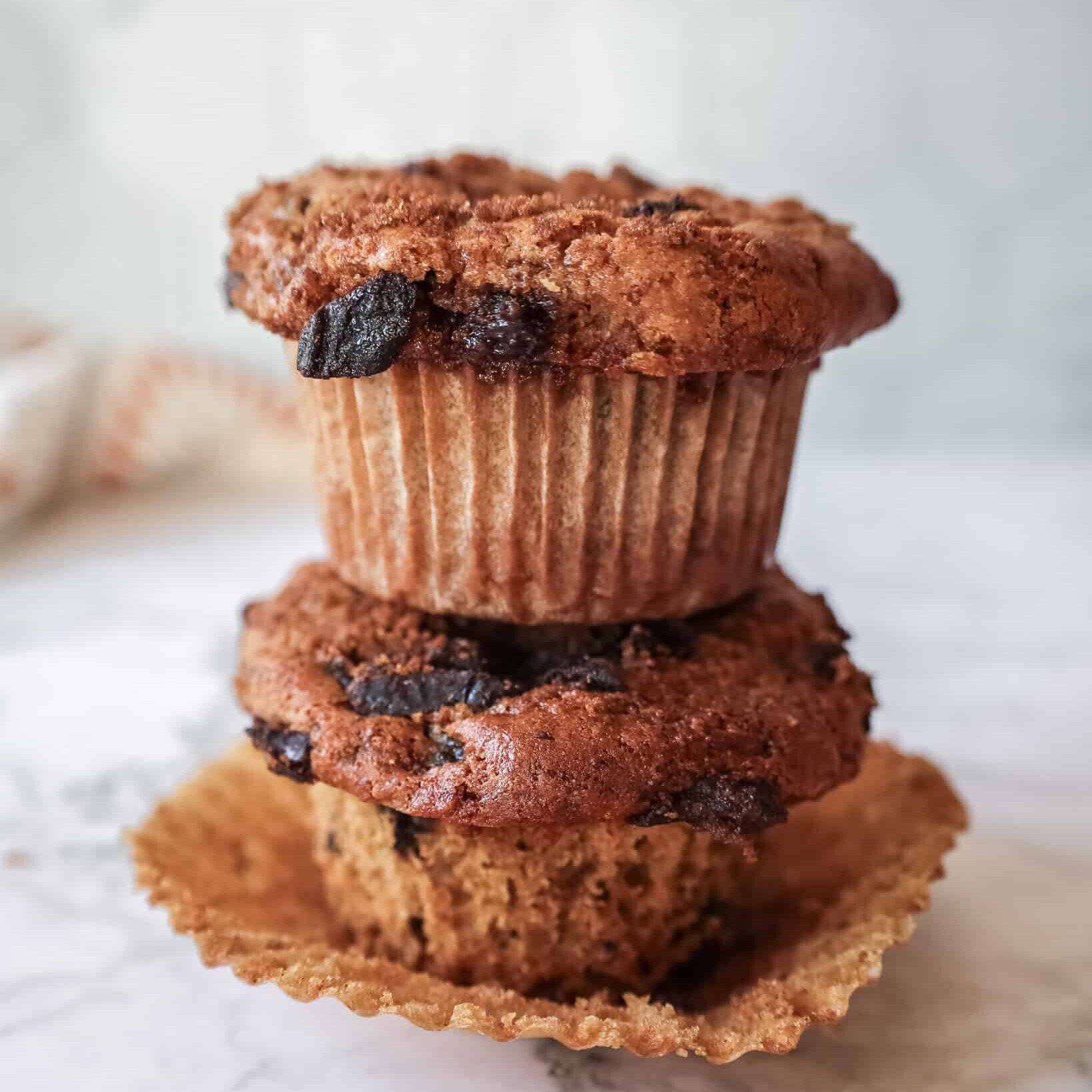 two prune cinnamon muffins stacked on each other