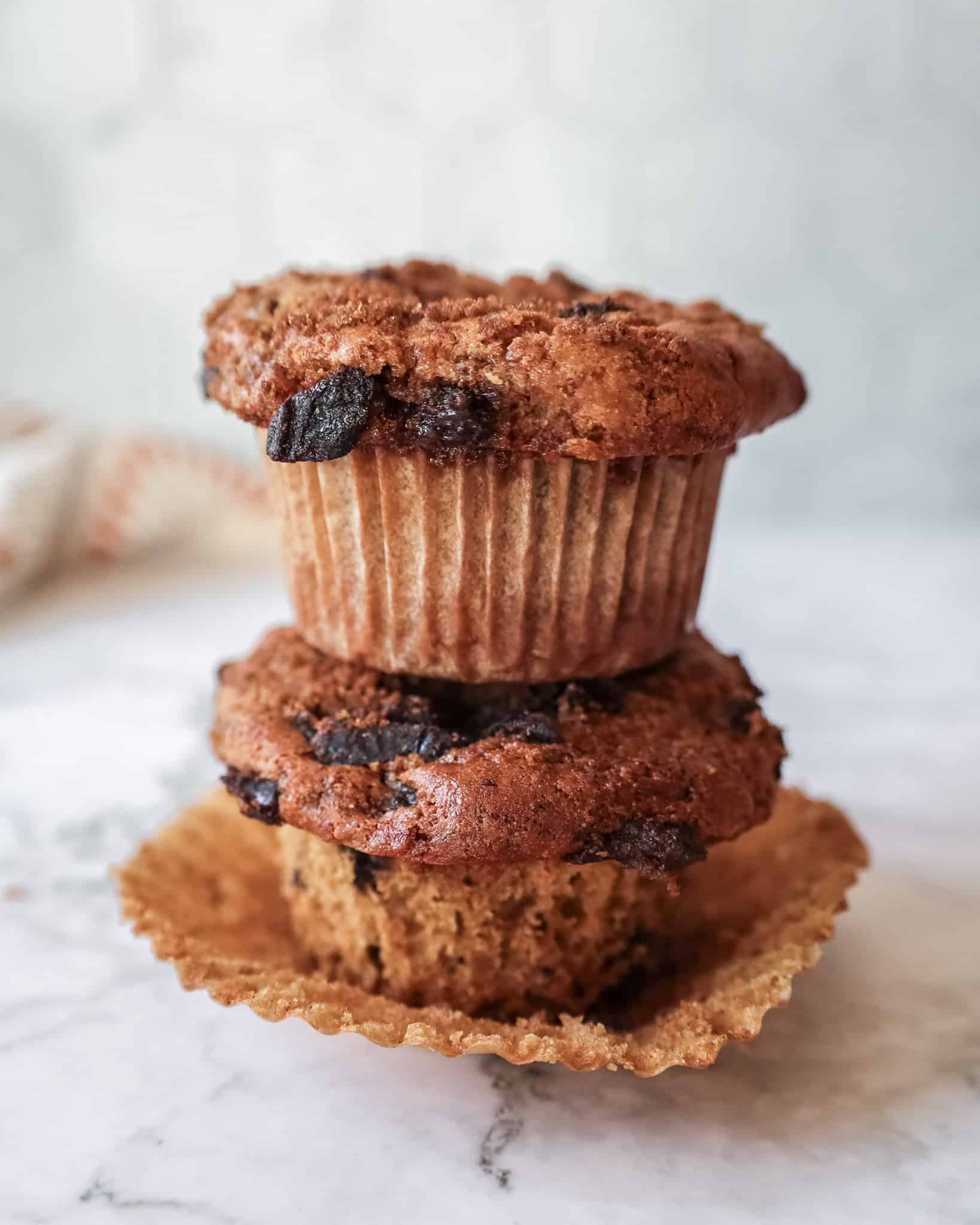 two prune cinnamon muffins stacked on each other